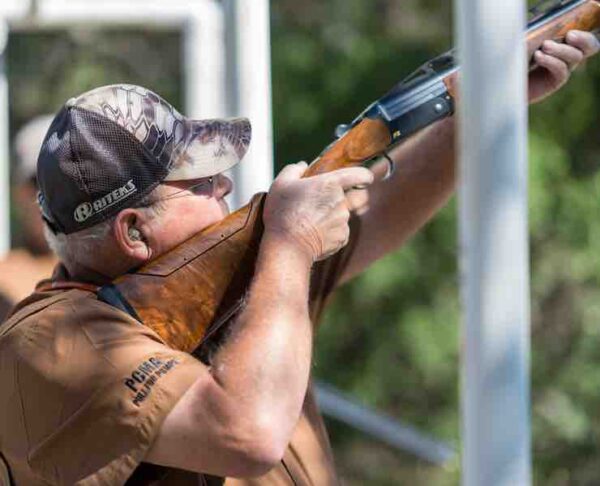 Man in PCMA shirt skeet shooting